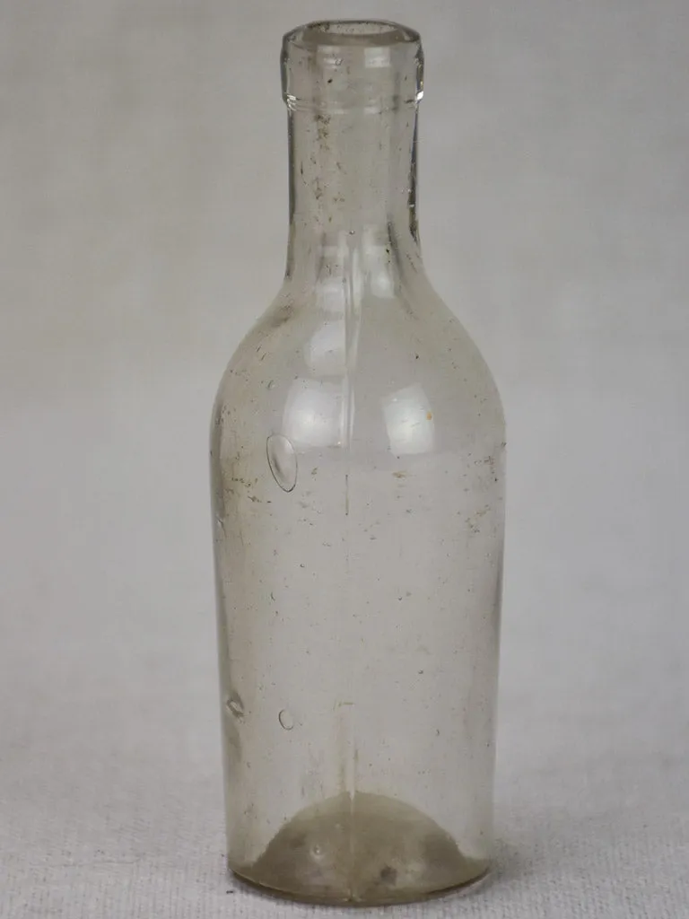 Miniature late 19th century blown glass bottle 4¾"